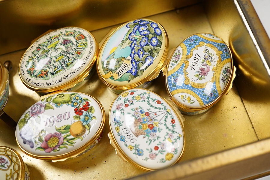 Eight Halcyon days enamel year boxes and an enamel egg shaped box on stand (9)